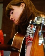 Sarah playing guitar