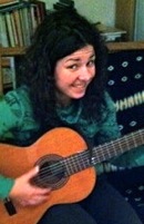 Ariane playing guitar
