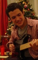 Thomas playing guitar